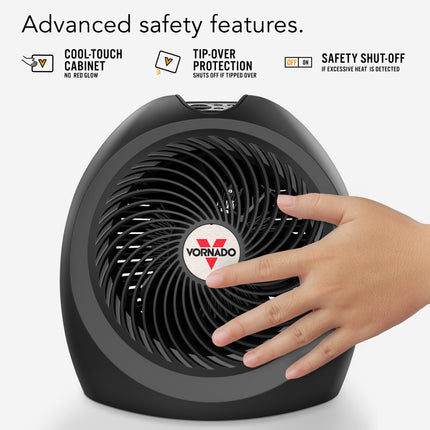 Vornado fan with a hand touching it, highlighting safety features on a white background