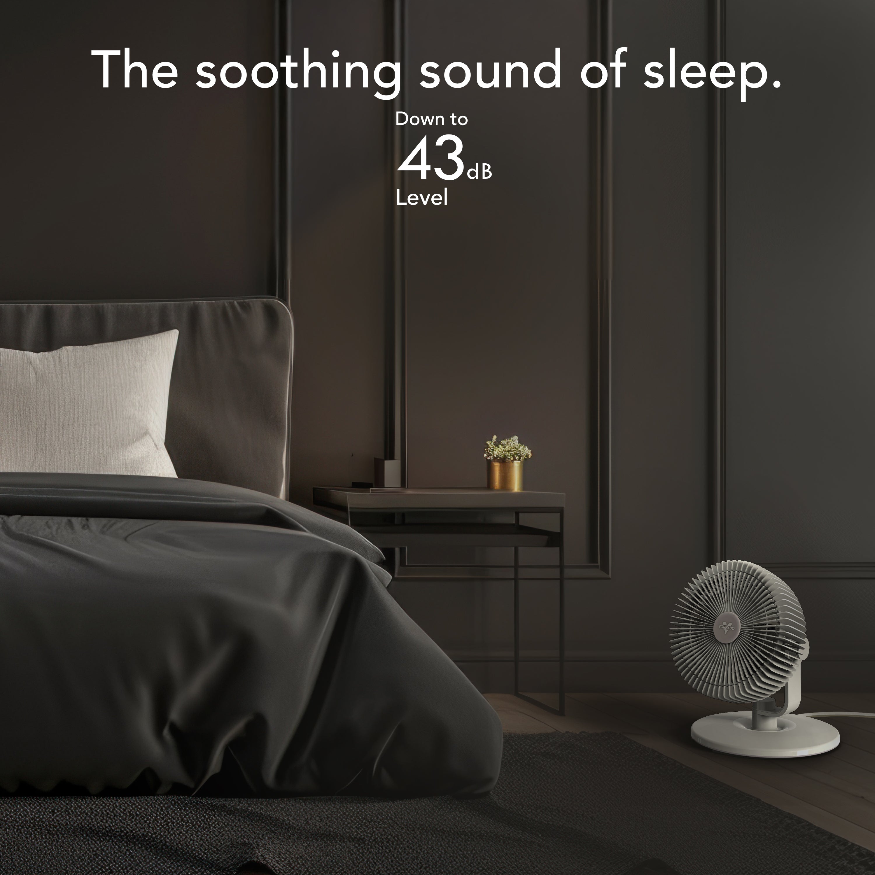 Modern bedroom with a bed and a fan, featuring text about noise level.