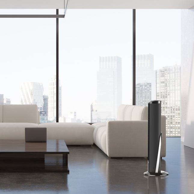 Modern living room with a white sofa and a tower fan.