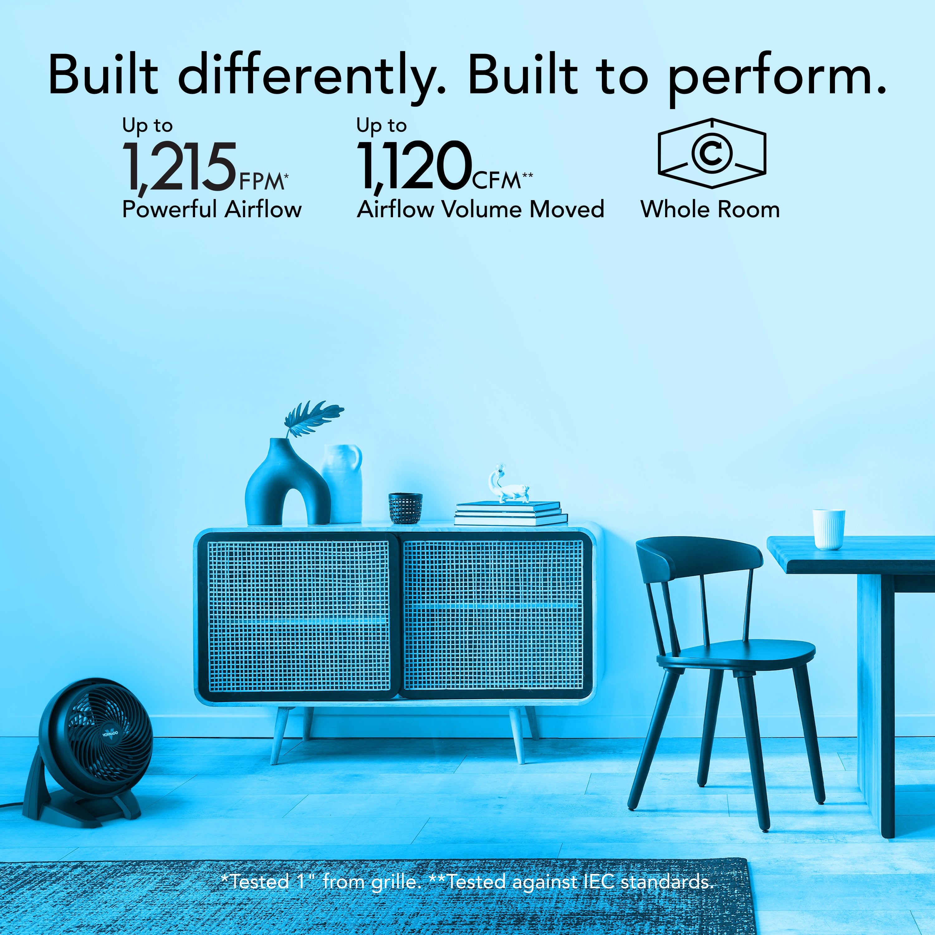 Modern room with a fan, table, and chairs, featuring text about airflow performance.