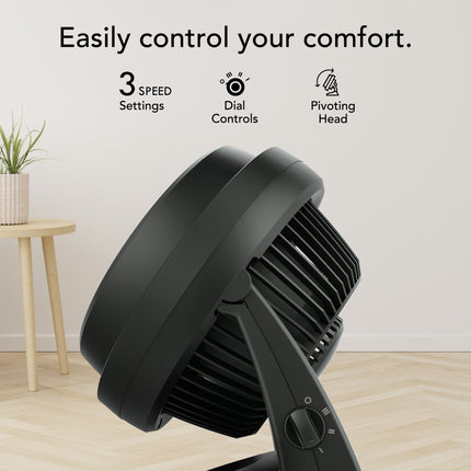 Black fan in a room setting, featuring text on comfort control.