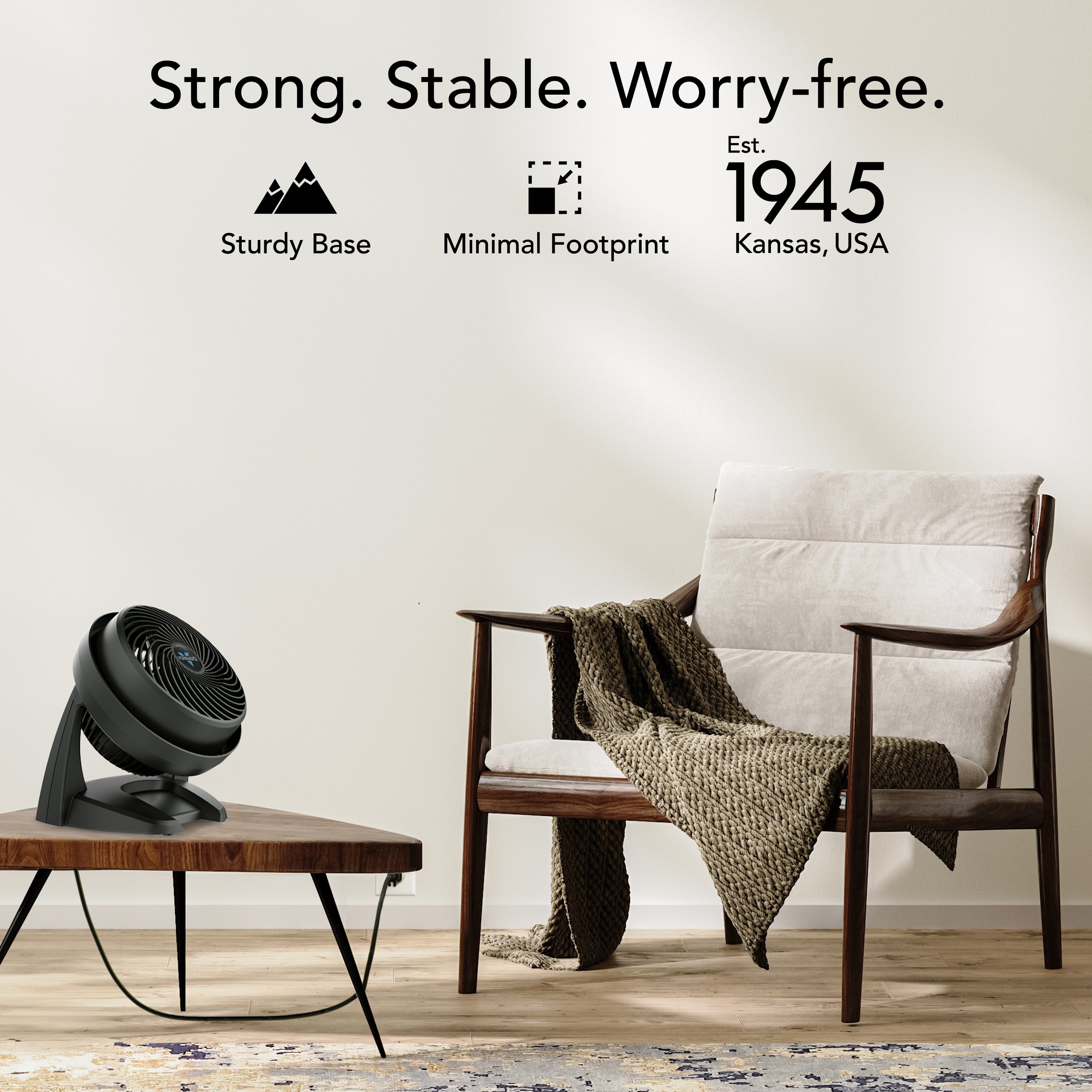 Modern chair with a blanket and a small table with a fan in a room setting, with text about product features and establishment year.