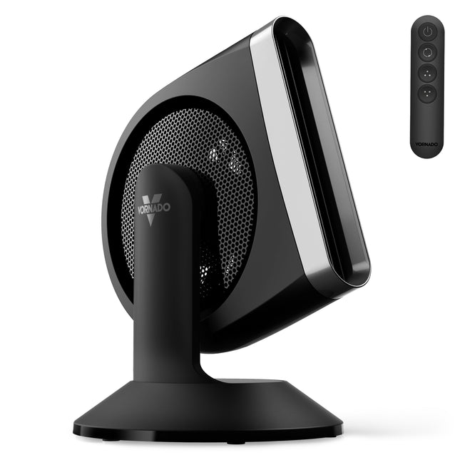 Black and silver desk fan with remote control on a white background