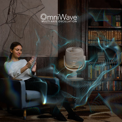 Woman using a smartphone in a room with bookshelves and an air purifier labeled 'omniWave'.