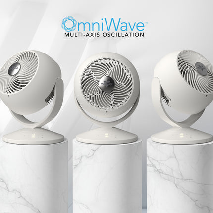 Three white oscillating fans with 'omniWave' branding on a marble background