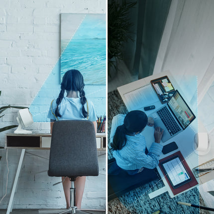 Person working at a desk with multiple devices in a home office setting.