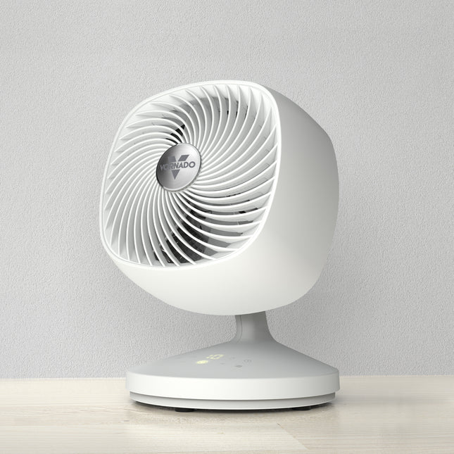 White desk fan on a light gray background