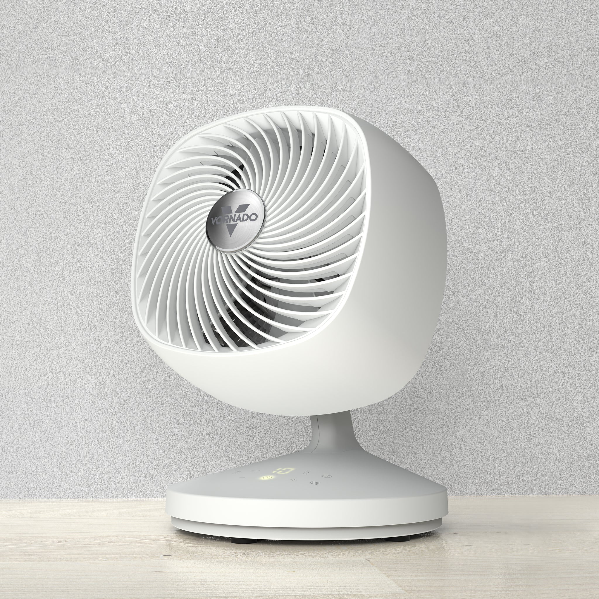 White desk fan on a light gray background