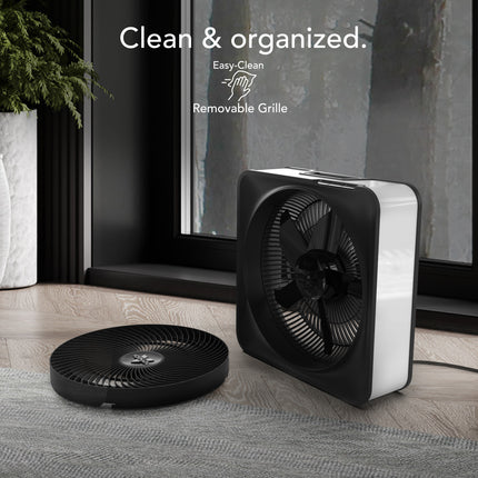 portable box fan with the grill off with a forest in the background with text.