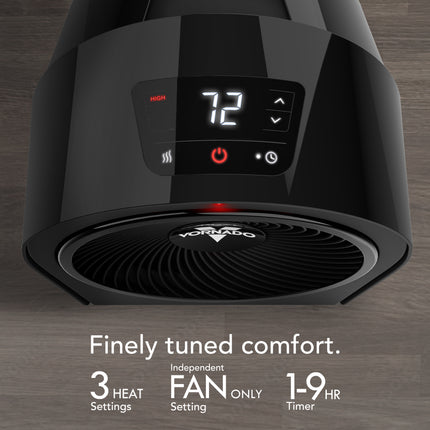Black heater with digital display on a wooden surface, featuring the brand 'Vornado'.