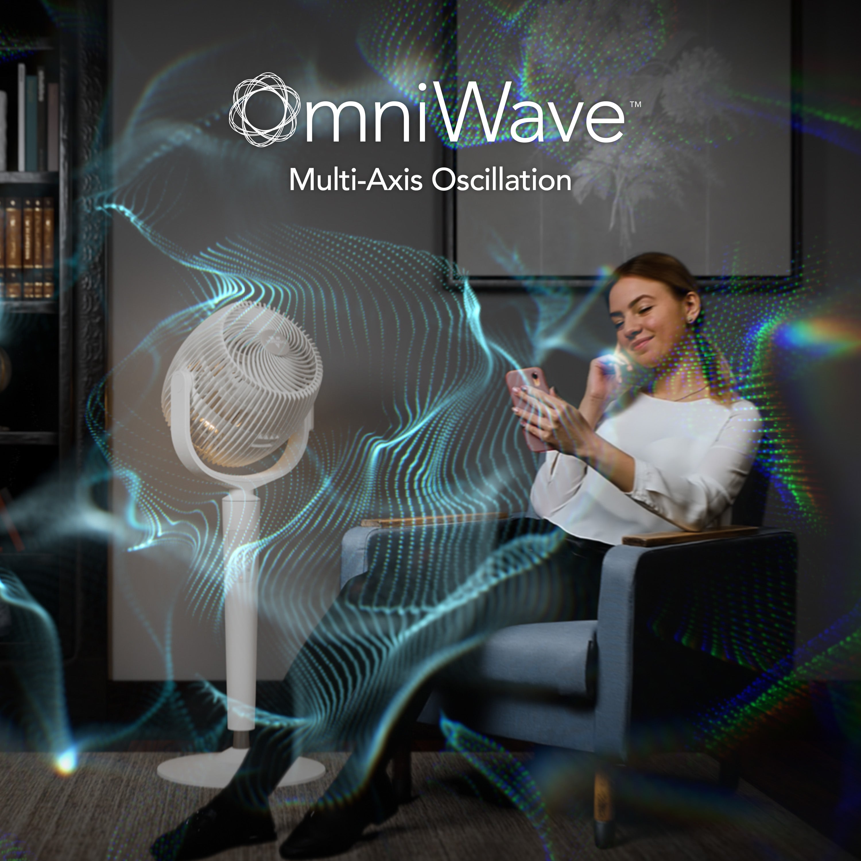 Woman using a smartphone and an EOS 9S blowing air all around the room with 'omniWave multi-axis oscillation