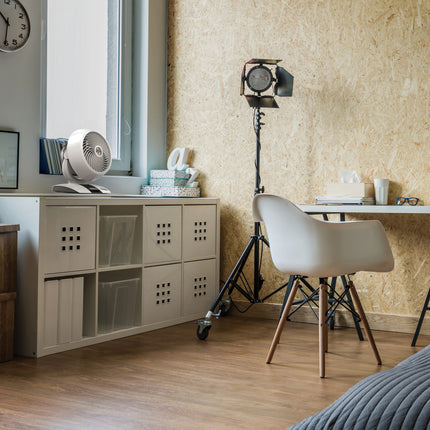 5303DC on a storage cubbie next to desk in a bedroom.