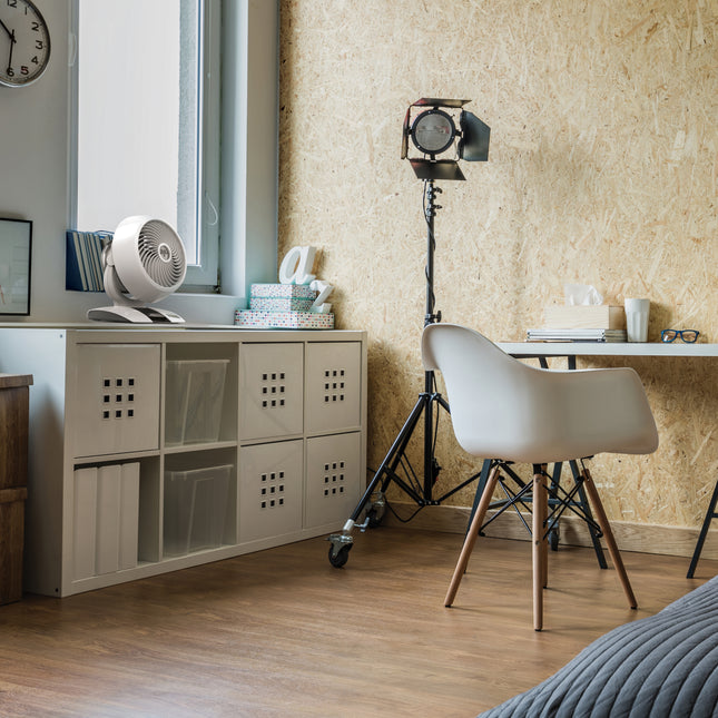 5303DC on a storage cubbie next to desk in a bedroom.