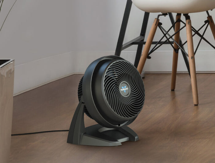 630 Air Circulator on a hard wood floor by a potted plant