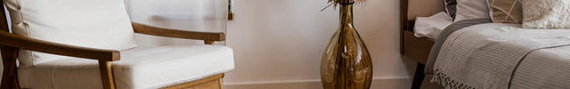lifestyle of a ev100 evaporative humidifier in a living room near a chair