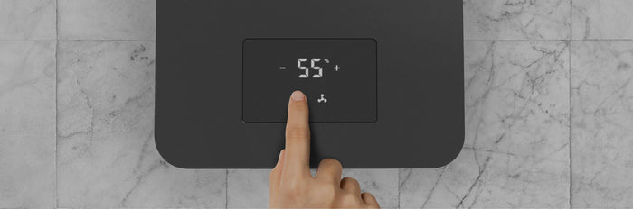 A finger hovering over EV3's control panel