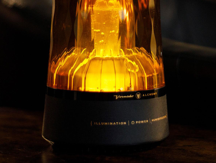 Lucerna 1 on a wood table showcasing the illumination of the Lucerna 1.