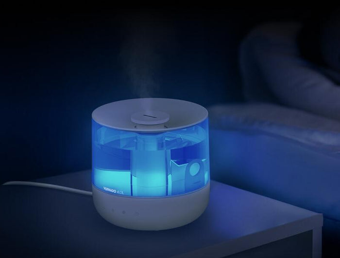 Woman sleeping with Mistic 4 on her side table