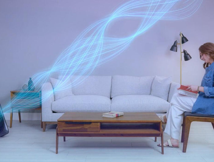 Woman sitting while Model 80X is blowing out cool air
