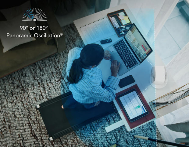 Top view of a woman working at her desk. To the side is Movio 6 with a blue overlay coming out of it, showing the 90° or 180° panoramic oscillation.