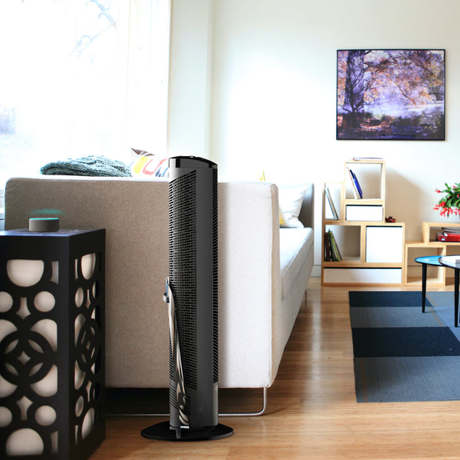 OSCR37 AE next to a sofa in a living room.