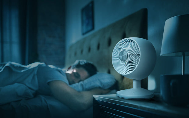 Man sleeping with Omnio 7 on desk in sleep mode.