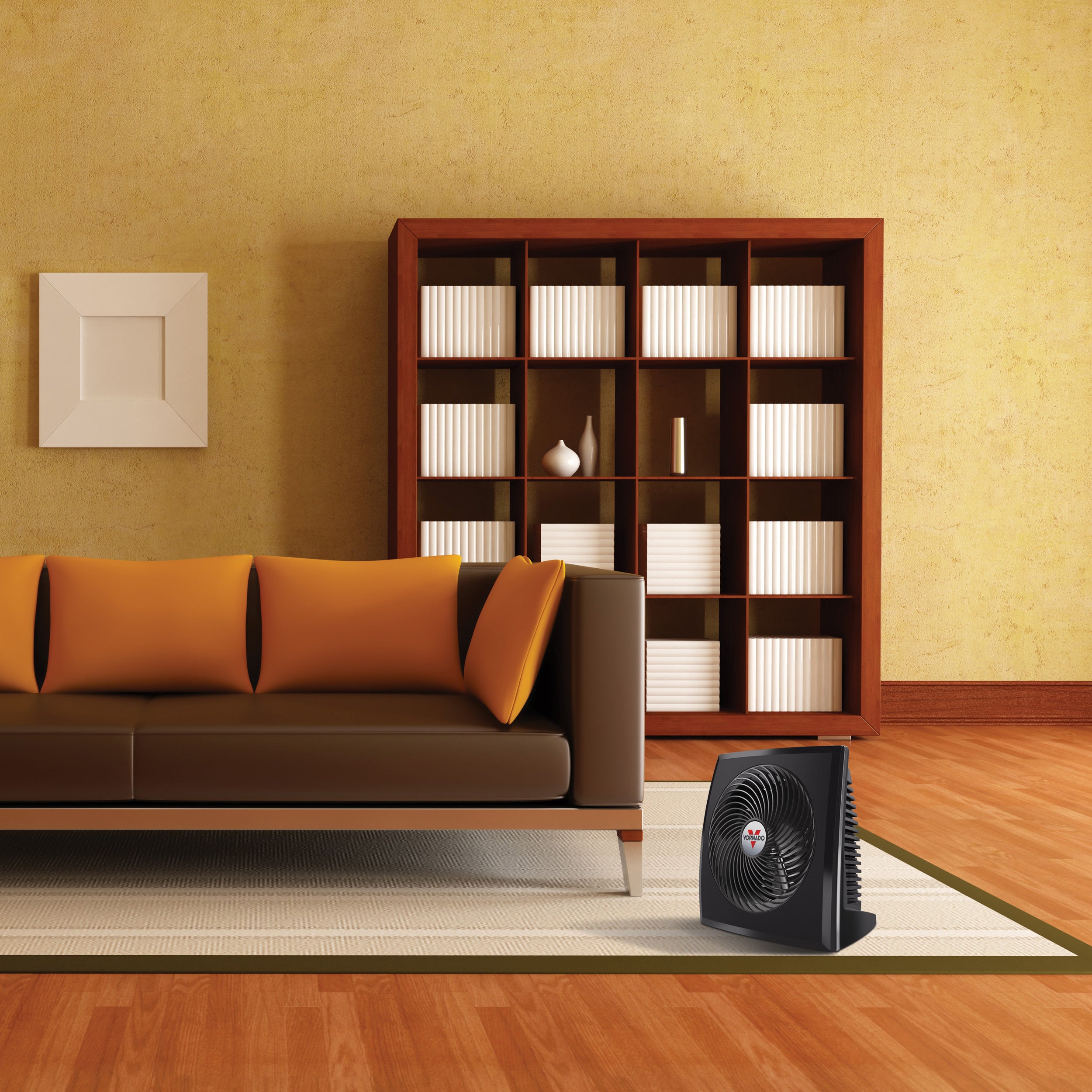 PVH heater on the floor in an orange tinted living area and next to a brown leather couch