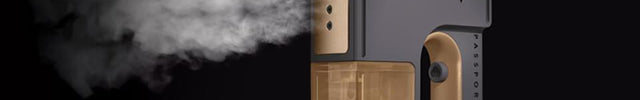 The passport handheld garment steamer against a dark background. There is steam coming out of the nozzle.