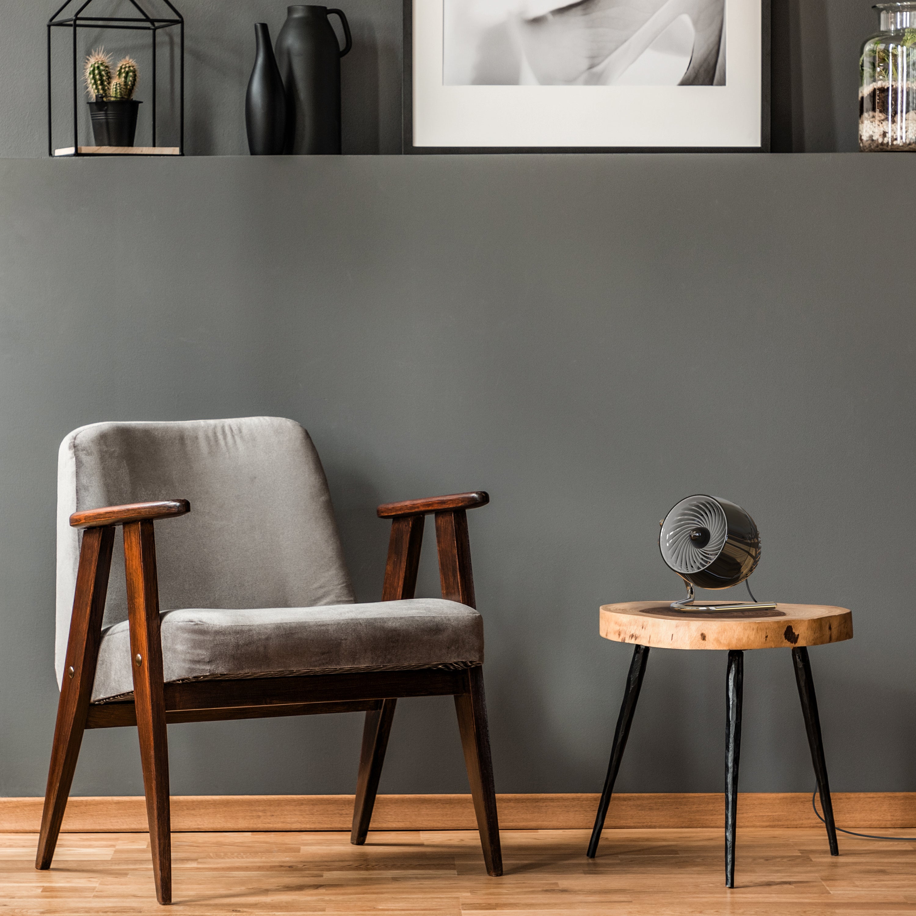 Pivot3 on side table next to chair in living area.