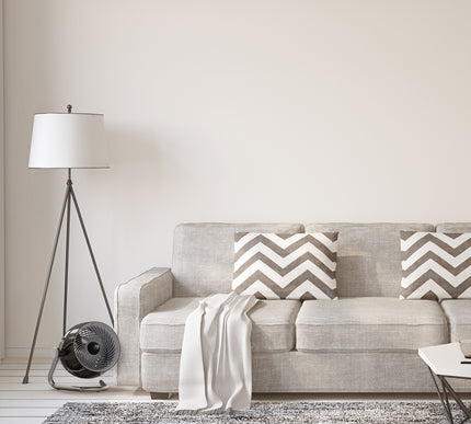 Pivot6 next to couch in a living room.