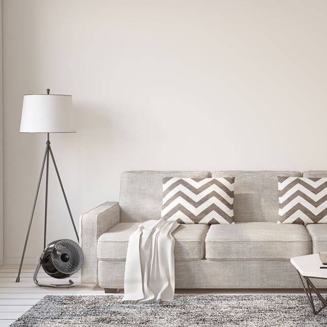 Pivot6 next to couch in a living room.