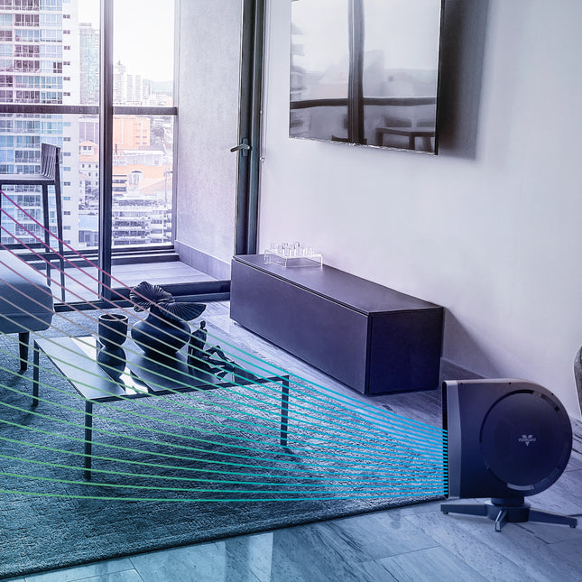 Modern living room with a projector and soundbar, cityscape visible through window.
