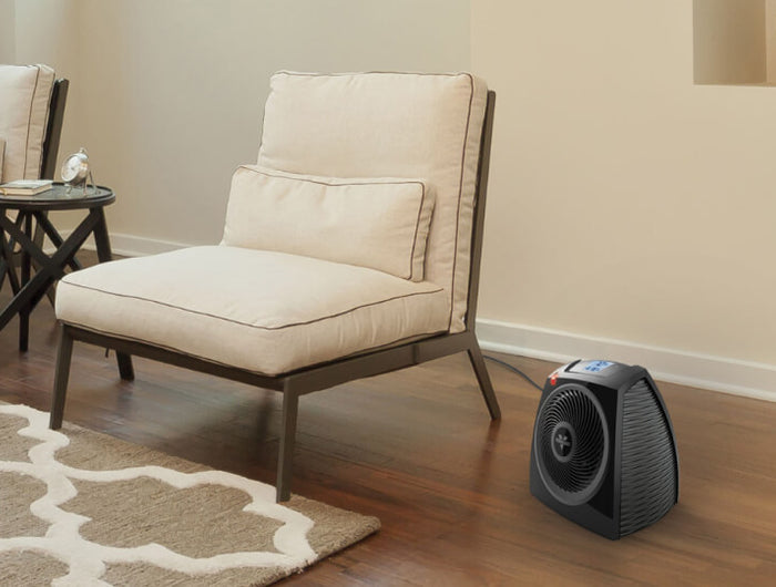 TAV10 in a living room near a chair.