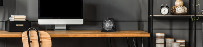 Lifestyle of VH204 on a desk near a monitor.