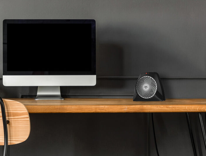 Lifestyle of VH204 on a desk near a monitor.