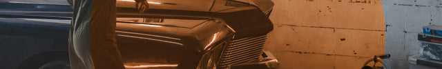 A woman working on her car in her garage. The Velocity HD heater is in the corner. There is an orange transparent circle to indicate spot heat.