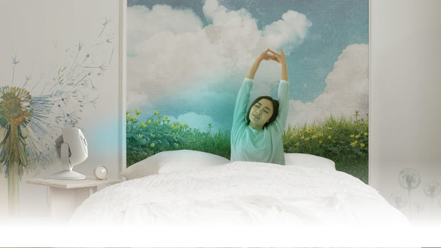 Woman sitting up in bed stretching as Vora 8's breeze mode is activated.