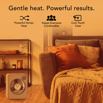Space heater with text 'Gentle heat. Powerful results.' in a living room setting.