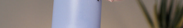 Image of a person removing Votiv 7's detachable tank from its base.