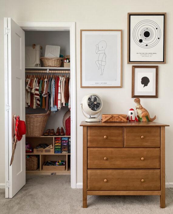 VFAN Vintage White on a wooden dresser in a child's room next to an open closet filled with colorful clothes