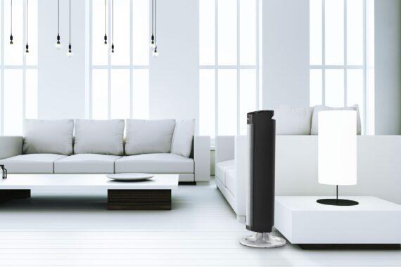 Lifestyle of a NGT33DC tower circulator in a spacious, white living room