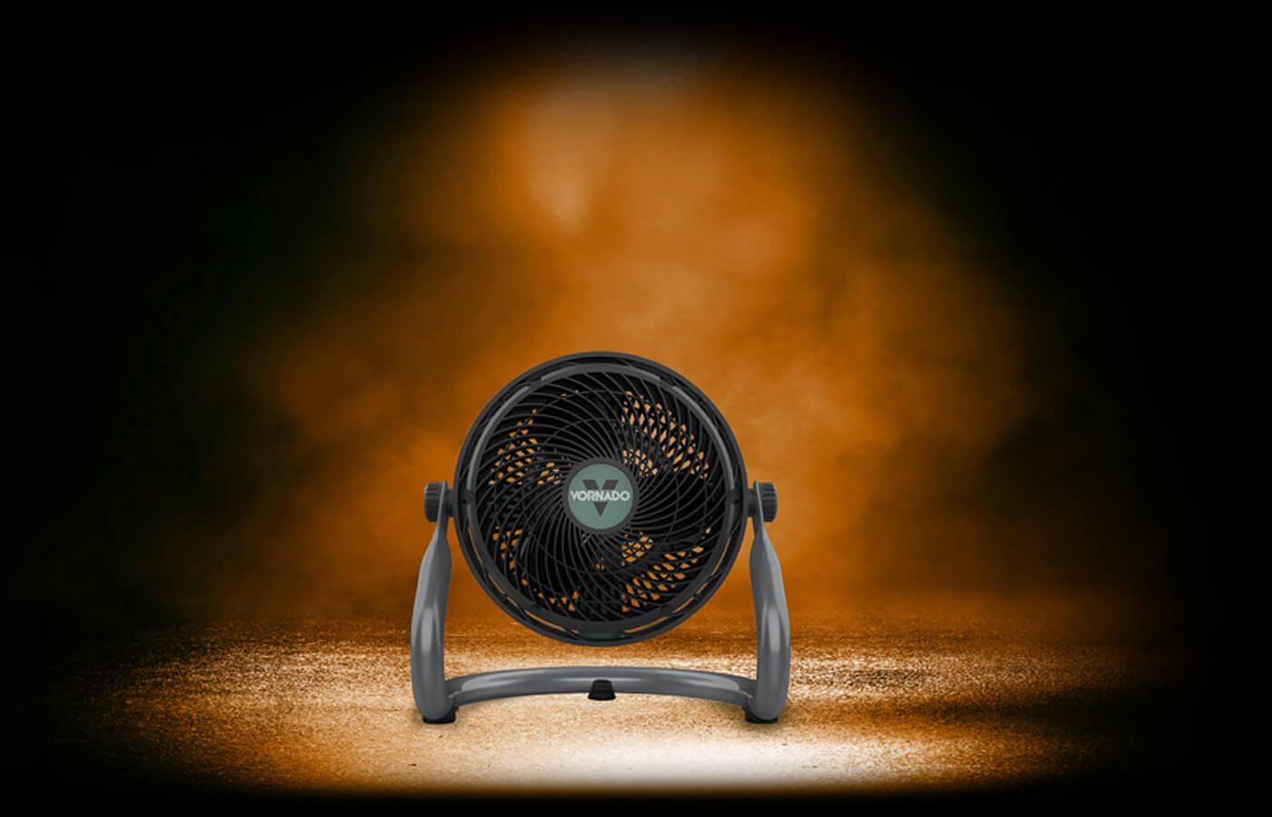 EXO61 HD on dark asphalt. The fan is under an orange light with orange smoke in the background surrounded by darkness
